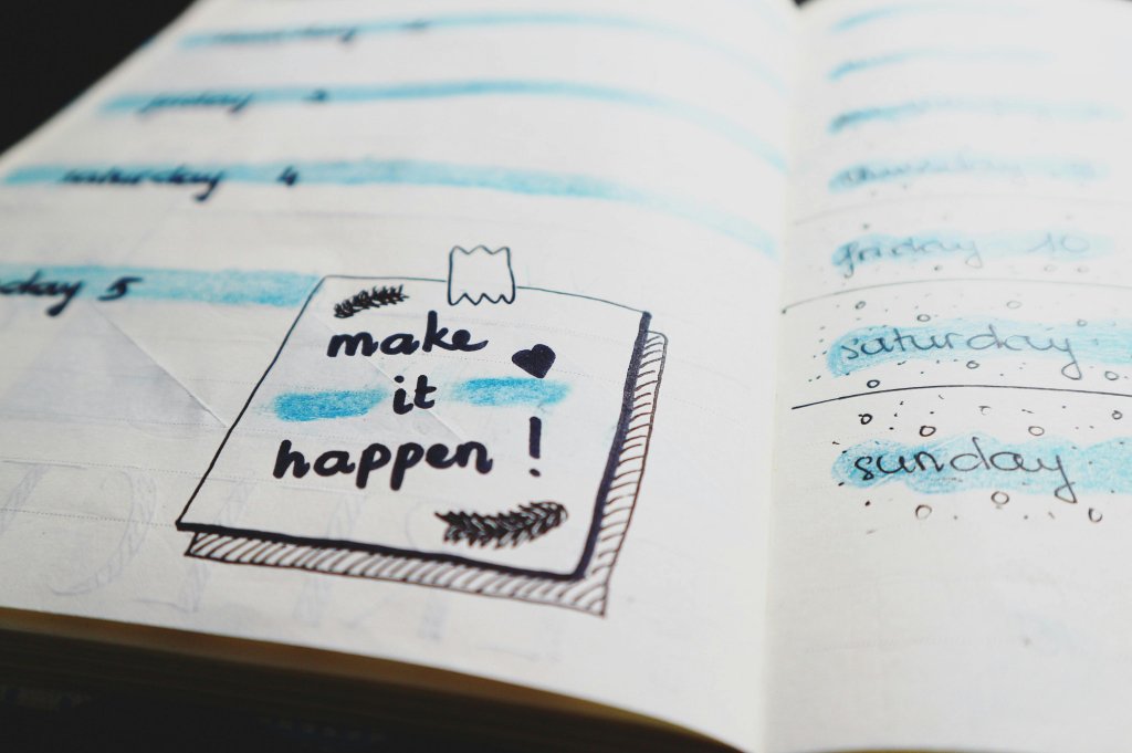 White accountability journal with black and blue writing on it.